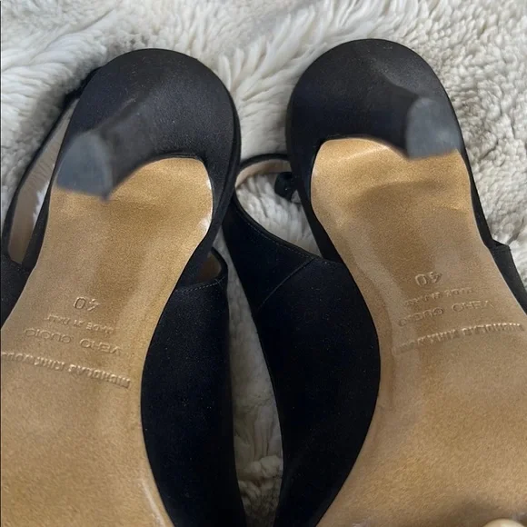 Nicholas Kirkwood black sling-back heals with signature pearl platform.